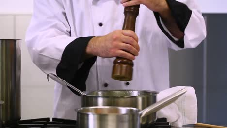 cook stirring and flavoring soup