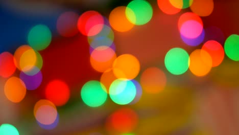 blurred colorful lights. red, green, yellow, orange, blue defocused glittering bokeh festive background.