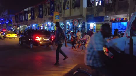 busy night street scene in west african city