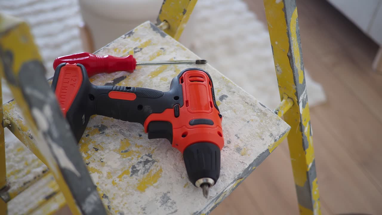 Power Drill and Screwdriver on Ladder