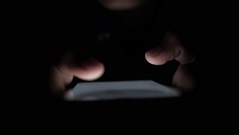person using a smartphone at night