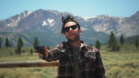 A-caucasian-man-battles-to-shoot-a-jammed-gun,-in-a-remote-wilderness-scenario