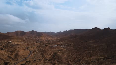 stunning aerial view of the arid landscape and small village of ksar hallouf, tunisia.