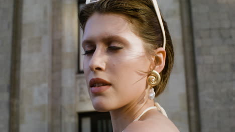 close-up view of elegant woman with sunglases on her head