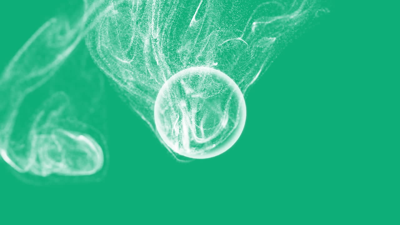 Abstract swirling particles and smoke animation over green background