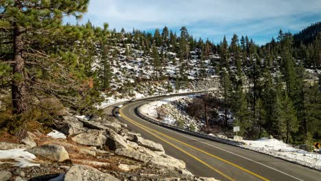 winter holiday traffic timelapse in the sierra nevada mountains along curvy and windy highway 50 near lake tahoe, california