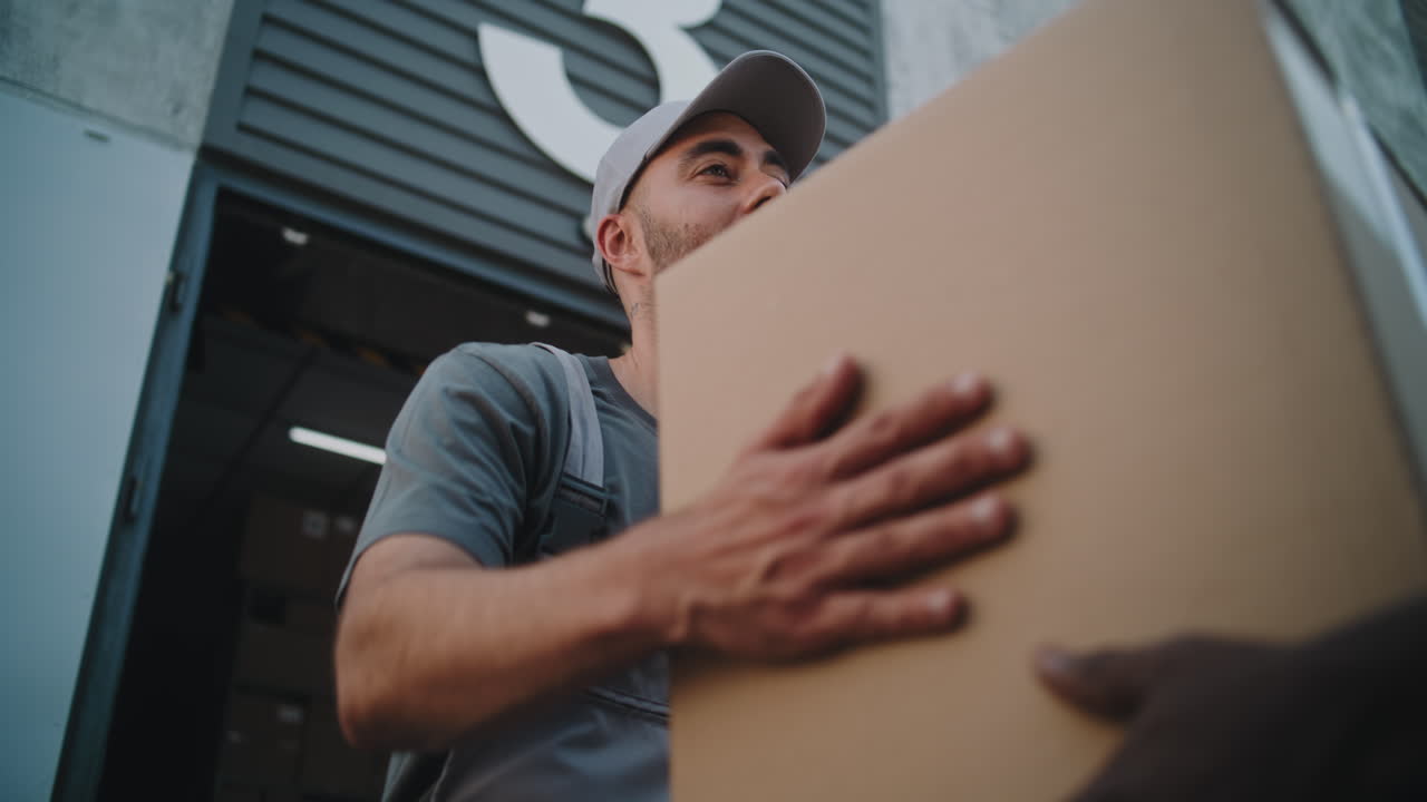 Workers delivering and handling packages at a warehouse