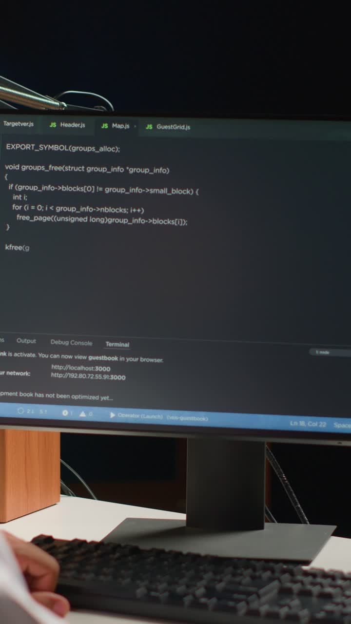 Vertical video Engineer writing code at home
