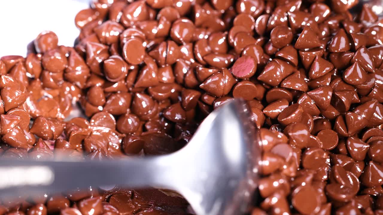 Mixing chocolate chips with a spoon