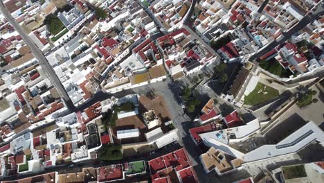 amazing droneshot from above: the famous white town conil in andalusia spain, sunny weather