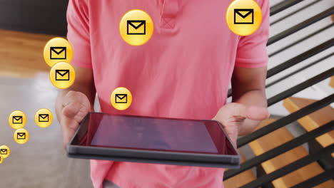 holding tablet, person surrounded by animated email icons in digital environment