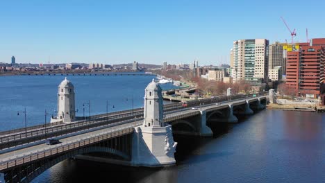 aerial establishing city skyline of cambridge boston massachusetts with longfellow bridge and subway train crossing 1