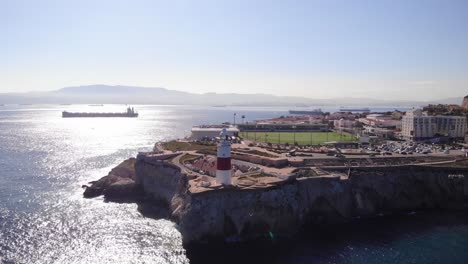 Aerial-Rising-View-Of-Europa-Point-With-scenic-Strait-of-Gibraltar-In-Background-On-Sunny-Day