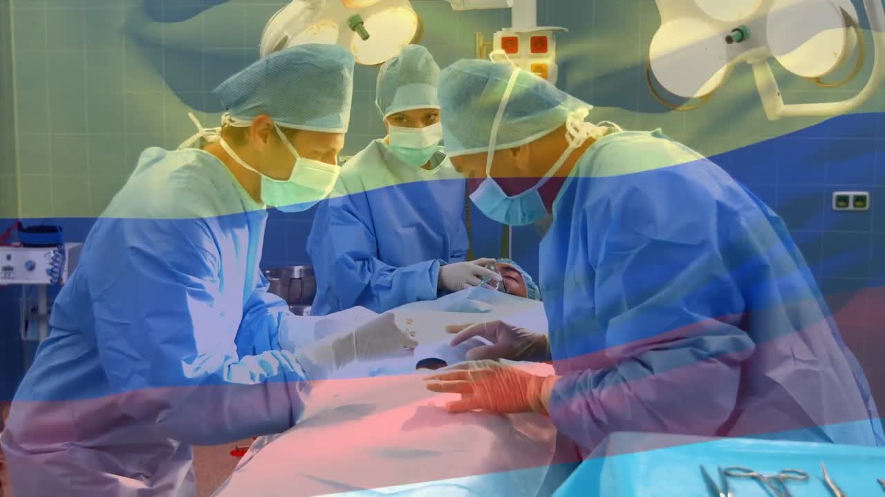 animación de la bandera de colombia ondeando sobre los cirujanos en el quirófano