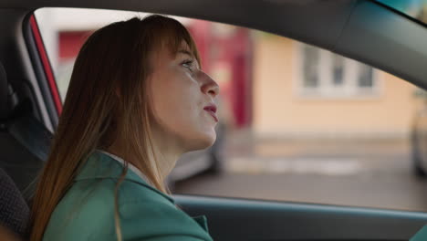 satisfied woman moves to dynamic music while driving car