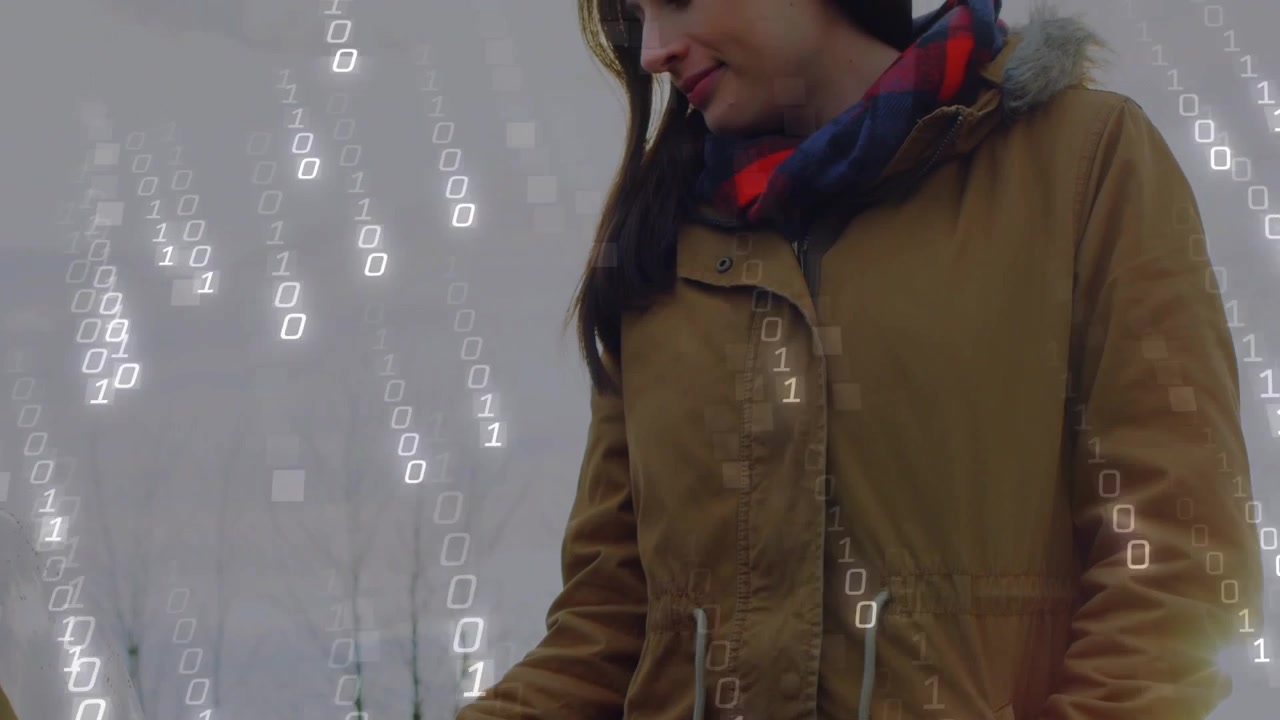Woman in tan parka and red-blue scarf connecting EV charger to car outdoors under binary overlay