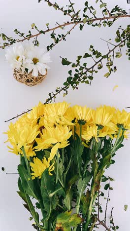 yellow and white flowers arrangement