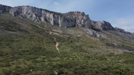 Aerial-drone-shot-of-El-Torcal-de-Antequera-nature-reserve-and-mountains-in-Spain