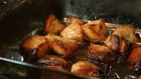 crispy roast potatoes in bubbling oil fresh out the oven