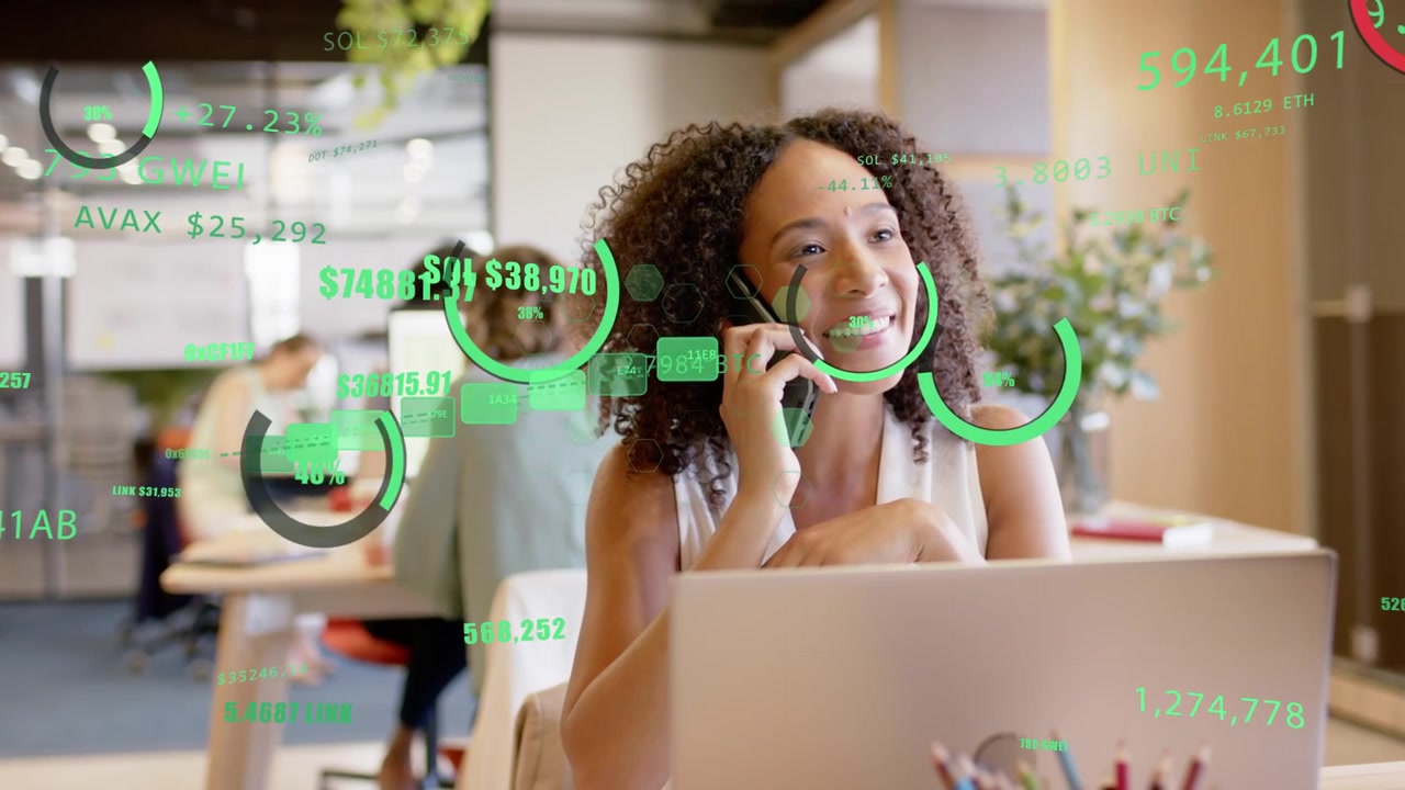 Woman receiving phone call and discussing finance data, gesturing at animated green HUD charts