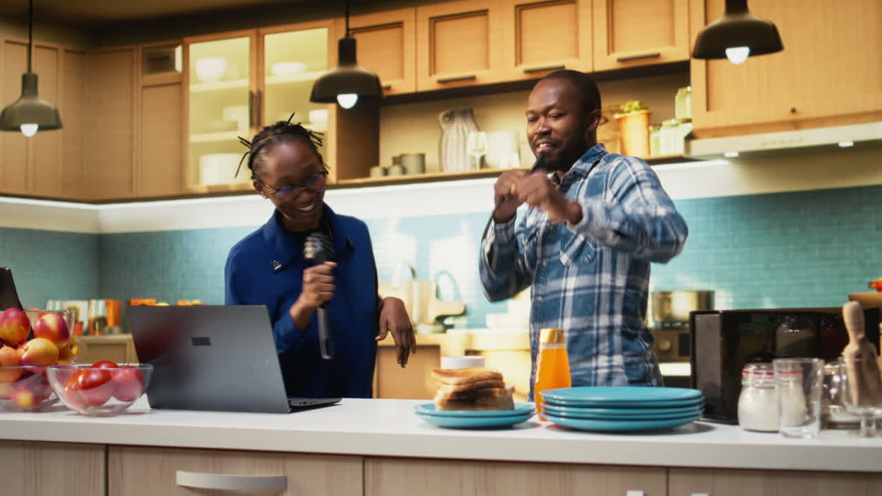 People Singing Karaoke in Kitchen