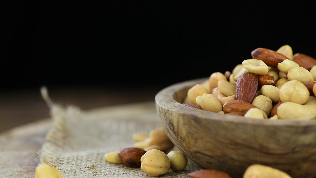 Freshly roasted nuts on a rotating plate (seamless loopable)