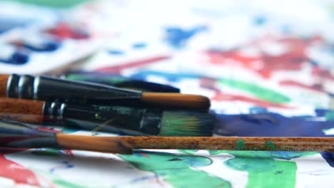 child's art and paintbrushes