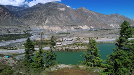 dhumba lake with majestic nilgiri mountain range in background near jomsom, nepal