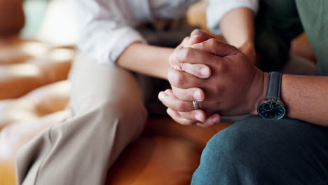 supportive couple holding hands