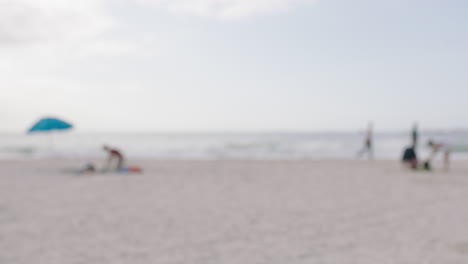 blurred beach view concept of people relaxed seaside activity unfocused