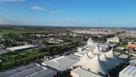 Aerial-drone-footage-of-the-famous-Butllins-holiday-camp-based-in-the-seaside-town-of-Skegness-Lancashire,-UK