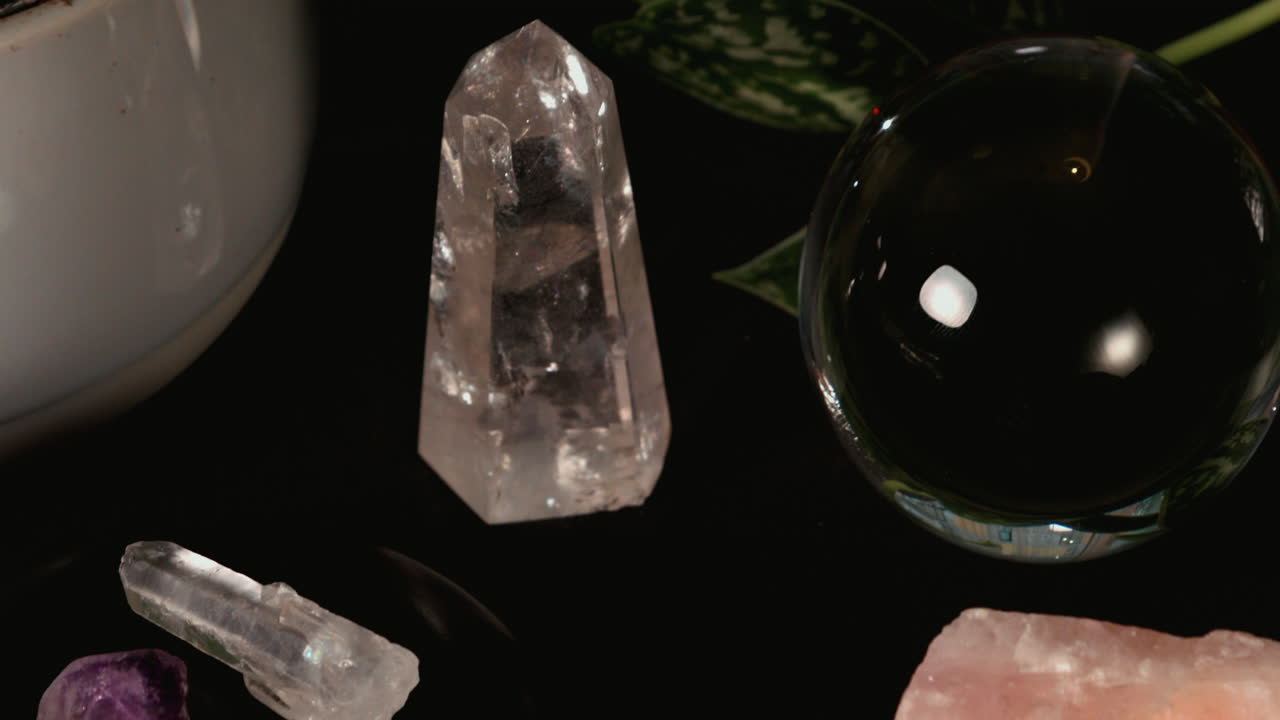 Close up details of a crystal ball candle magick ritual