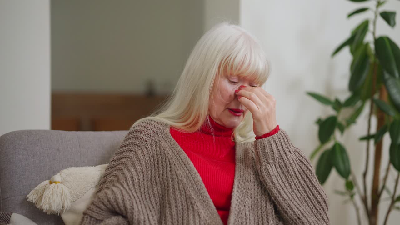 Sad older woman at home