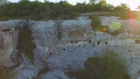 ancient cave dwellings on a hillside