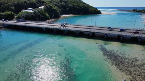 Crossing-The-Bridge-Over-Tallebudgera-Creek-In-Burleigh-Heads,-Gold-Coast,-Queensland-Australia