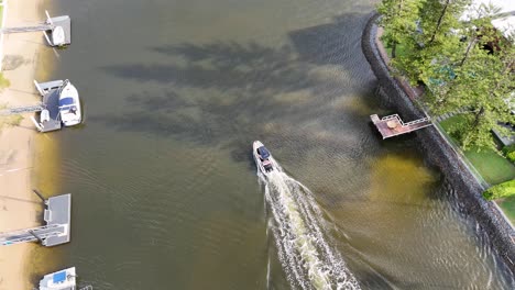 aerial view of canal with boats and houses