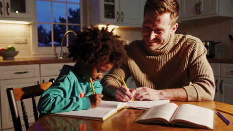 father and child doing homework together at home