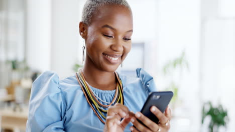 Phone,-typing-and-smile-of-black-woman-in-office