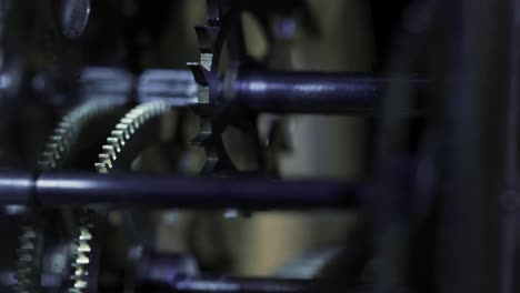 close up macro of an old clock mechanism clockwork gear ticking