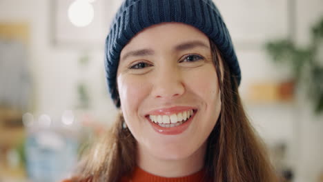 portrait of a smiling woman wearing a beanie