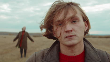 Portrait-of-Young-Man-on-Autumn-Field