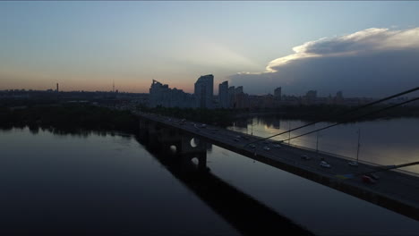 aerial view car driving on hanging bridge on city building background