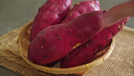 fresh japanese sweet potatoes on basket