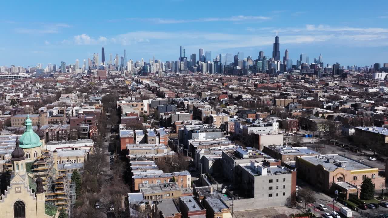 Cinematic Establishing Drone Shot Above Chicago. Skyline in Background.