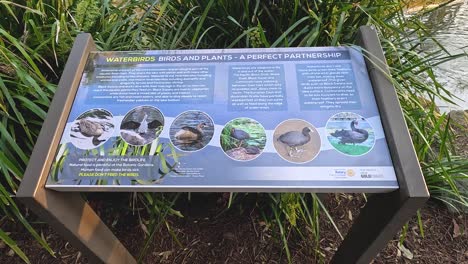 educational sign and scenic garden landscape