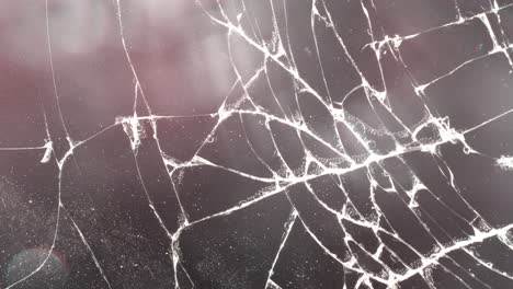 background animation of cracked glass with lights and lens dirt