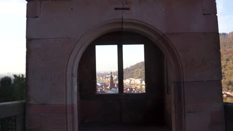 an amazing sunset view through a castle balcony and tower lookout.