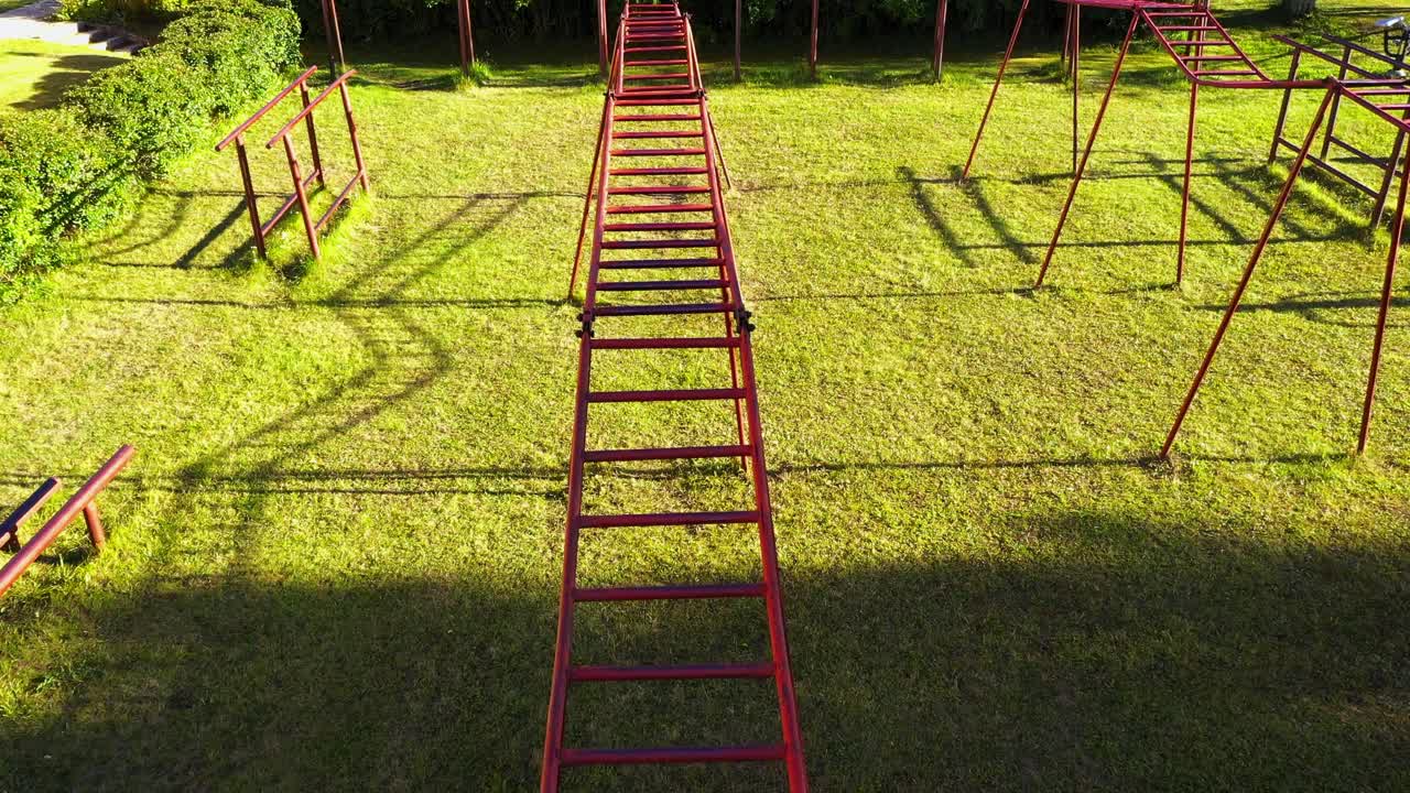 Climbing ladder on local outdoor gym, rusty metal, aerial view