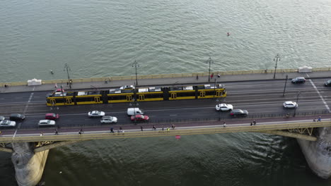 aerial - margaret bridge on the danube river, budapest, hungary, pan left tilt up