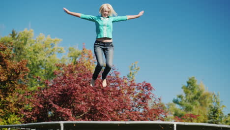 middle aged woman jumps on trampoline